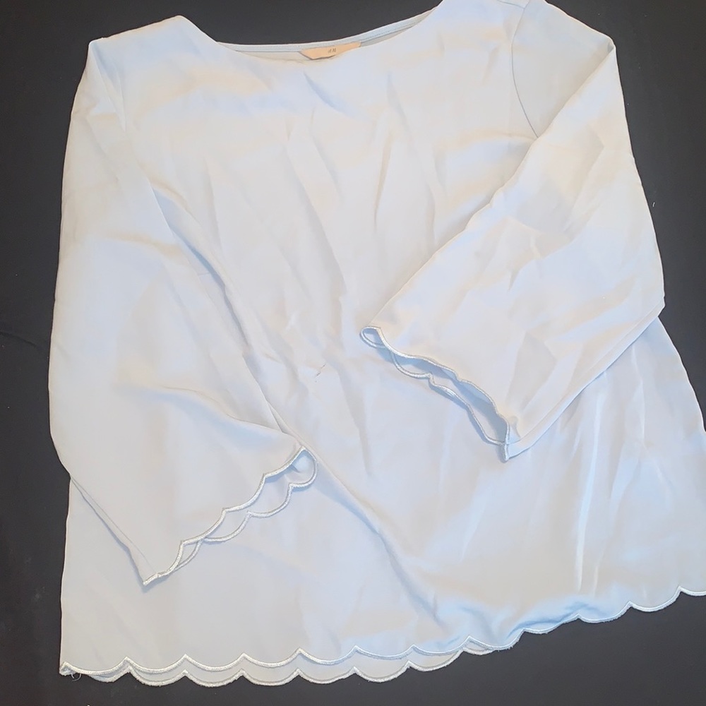 Light blue shirt. Worn a couple of times. Good condition